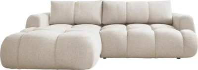 A beige sectional sofa is shown against a white background.