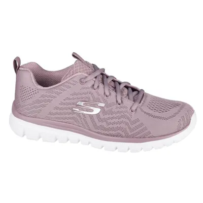 A side view of a lavender Skechers shoe against a white background.