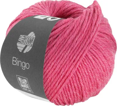 A ball of pink yarn with a dark gray label.