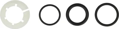 A set of plumbing parts, including a white plastic washer and three black rubber O-rings, laid out on a white background.