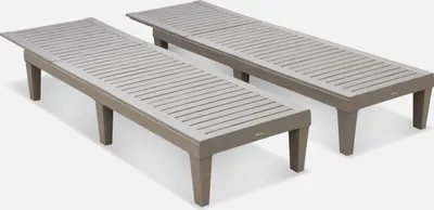 Two grey sun loungers are shown from a slightly elevated diagonal angle against a white background.