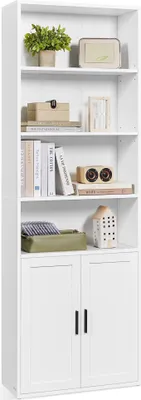 A tall white bookshelf with several shelves and two doors at the bottom, displaying various decorative items and books.