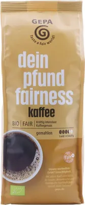A bag of ground coffee with a cup of coffee shown on the side.