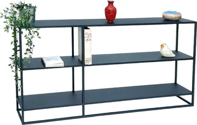 A dark grey metal console table with three shelves, decorated with a plant, books, a vase, a bird figurine, and a decorative bowl.