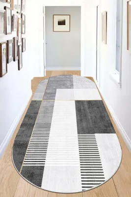 A hallway with a rug.