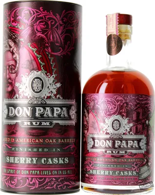 A bottle of Don Papa Rum and its cylindrical packaging are displayed side-by-side against a white background.