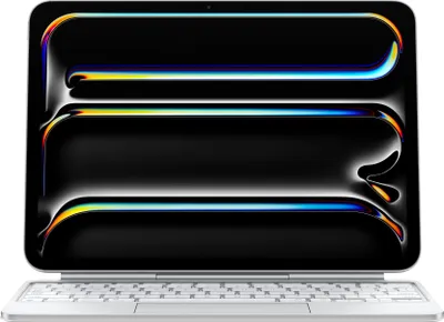 A white Apple Magic Keyboard for an iPad Pro is shown with its screen displaying a colorful, abstract wallpaper.