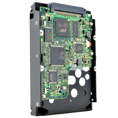 A close-up, studio shot of a hard drive's circuit board against a white background.