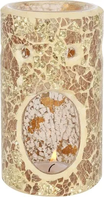 A mosaic oil burner with a lit candle inside.