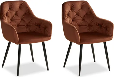 Two brown velvet chairs with black legs are shown against a white background.