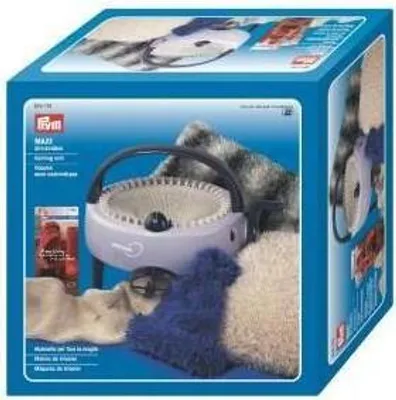 A product box for a PRYM knitting mill with various yarn colors and the knitting machine visible.