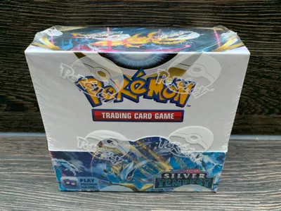 A Pokemon Silver Tempest Booster Box is shown from the front, sealed in plastic.