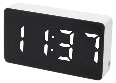 A digital alarm clock displaying the time.