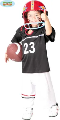 A young child dressed in a football costume, holding a football and giving a thumbs up.