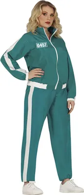 A woman wearing a teal tracksuit with white stripes, standing against a white background.