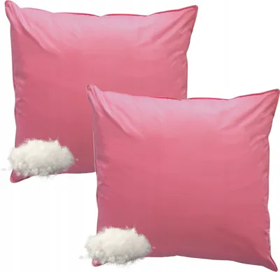 Two pink pillows with loose filling next to them.