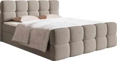 A bed with a headboard and bedding, shown against a white background.