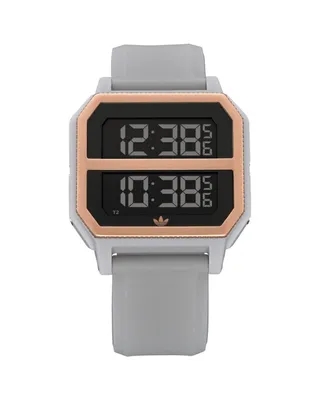 A digital watch with a gray band and a rose gold bezel.