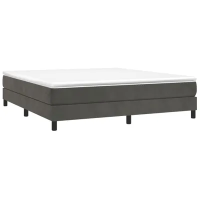 A dark gray bed frame with a white mattress topper.