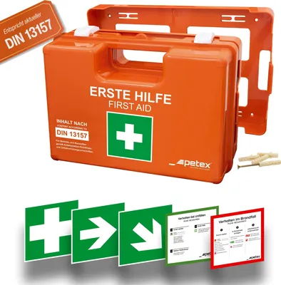 An orange first-aid kit with its wall mount and safety signs.