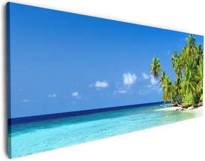 Produktbild von Wallario Premium Leinwandbild Blauer Himmel  weißer Strand  Palmen und das tiefblaue Meer in Größe 50 x 125 cm