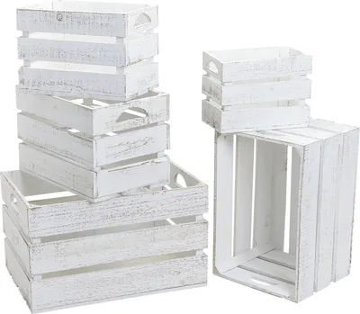 A set of five vintage-style wooden crates in white, stacked and arranged.