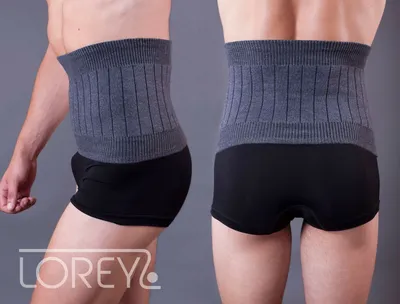 A man wearing a grey ribbed waist belt over black boxers, shown from the side and back.