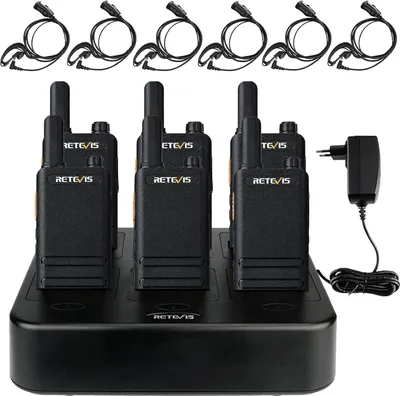 A set of six Retevis walkie-talkies are neatly arranged on a black charging base, with individual charging cables and a power adapter visible.