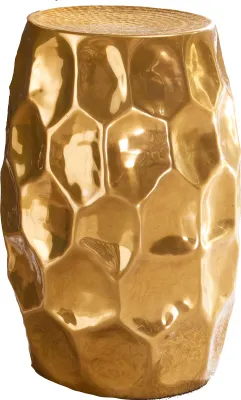 A gold-colored metallic stool with a hammered, honeycomb-like texture.