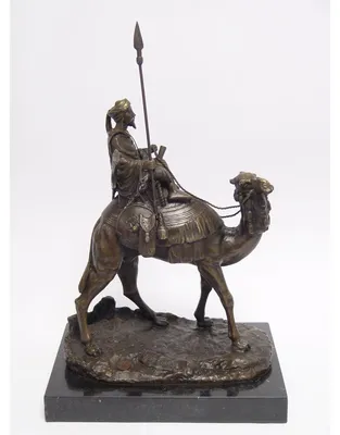 Produktbild von Eine Bronzestatue eines Kamels mit Reiter