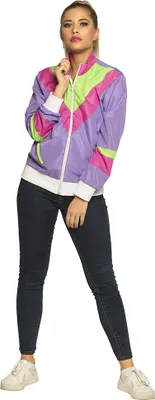 A woman is posing in a studio setting against a white background, wearing a retro-style jacket and jeans.