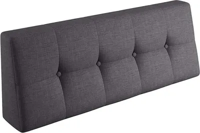 A dark gray tufted headboard is shown against a white background.