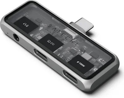 A product shot of a Satechi USB-C hub with a transparent top showing internal components.