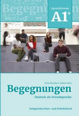 Students sitting on stairs in a modern building, some interacting with books or laptops.