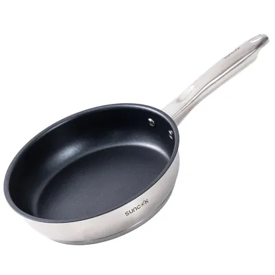 A stainless steel frying pan with a black non-stick interior and a silver handle, shown against a white background.