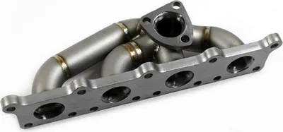 A metal exhaust manifold for a car, shown on a white background.