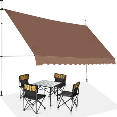 An outdoor awning setup with a table and chairs.