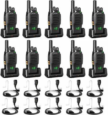 A collection of black walkie-talkies with charging docks and accessories, neatly arranged in rows against a white background.