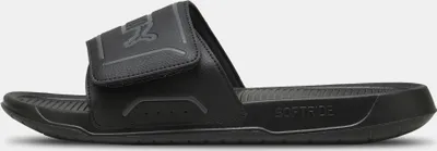 A black PUMA slide sandal is shown in a side profile against a white background.