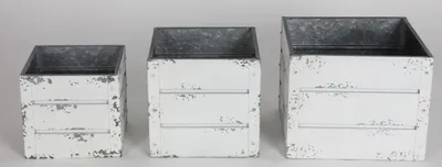 Three white decorative boxes of different sizes are arranged in a row against a white background.