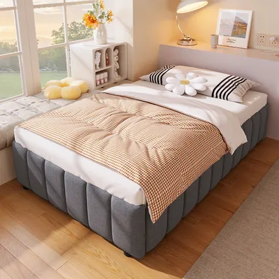 A bedroom scene with a bed, pillows, and a window.