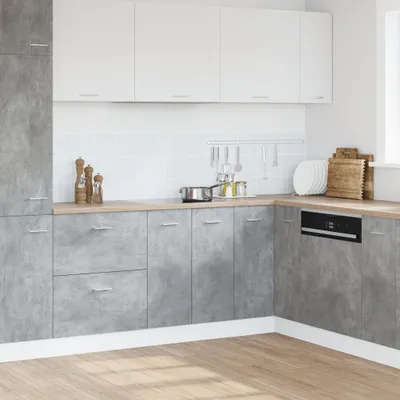 A modern kitchen with concrete-effect cabinets and white upper cabinets.