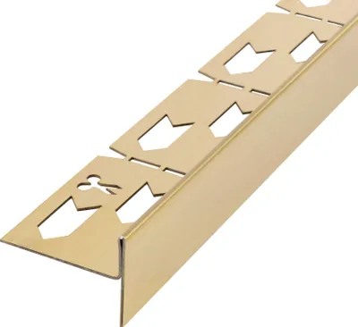 A close-up, angled view of a gold-colored metal profile with cutouts, isolated on a white background.