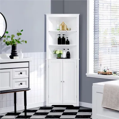 A white corner storage cabinet is shown in a bathroom setting, next to a vanity and a bathtub, with window blinds in the background.