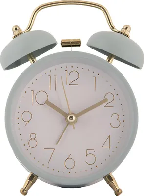 A light blue analog alarm clock with gold accents is shown against a white background.