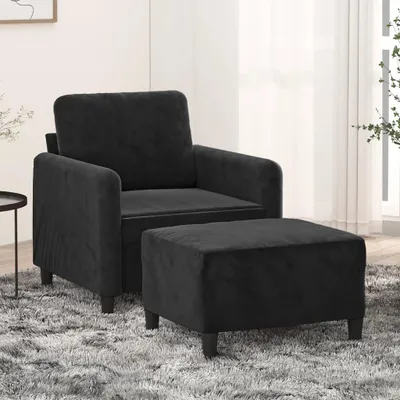 Zdjęcie produktu dla Czarny fotel z podnóżkiem, 60 cm, obity aksamitem, z solidną metalową konstrukcją i wygodnym siedziskiem, idealny do salonu i relaksu, w nowoczesnym stylu
