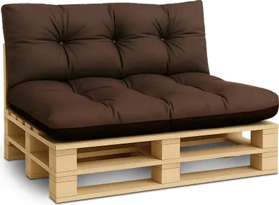 A brown cushion set on a wooden pallet.