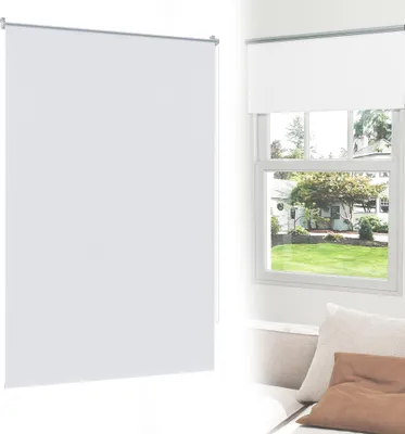 A white roller blind is shown in a split image. On the left, a large portion of the blind is visible against a white background. On the right, the blind is shown installed above a window, with a view of a house and garden outside.