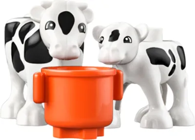 Two LEGO DUPLO cows and an orange bucket.