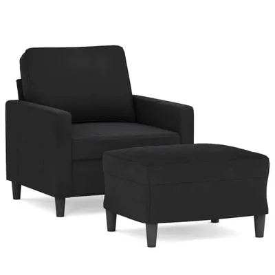 A black armchair and ottoman are shown against a white background.